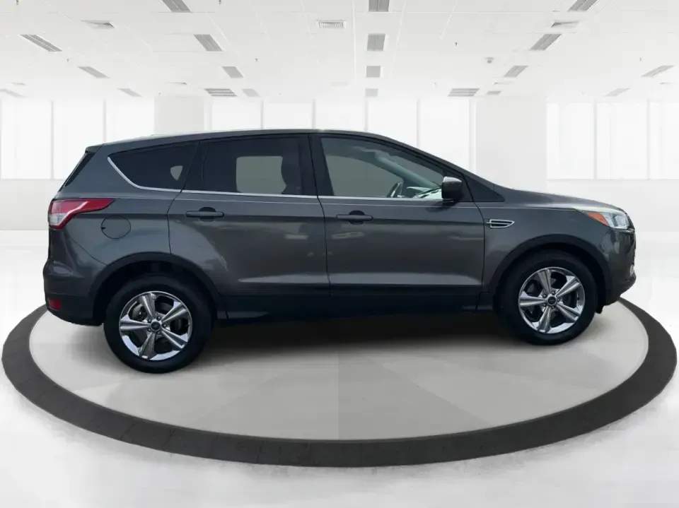 2016 Ford Escape SE (1FMCU0G75GU) with an 2.5L L4 DOHC 16V engine, 6-Speed Automatic transmission, located at 1099 N County Rd 25A , Troy, OH, 45373, (937) 908-9800, 40.057079, -84.212883 - Whether you're juggling school drop-offs, commuting up I75, or planning a weekend run to the Miami County Fairgrounds, this 2016 Ford Escape SE is the kind of practical SUV that fits real-life Troy, Ohio routines. With a versatile cabin, confident road manners, and easy-to-live-with features, it's a - Photo#1