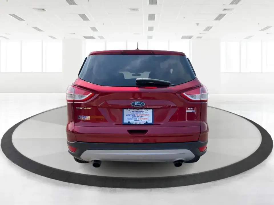 2014 Ford Escape SE (1FMCU9G9XEU) with an 2.0L L4 DOHC 16V engine, 6-Speed Automatic transmission, located at 4508 South Dixie Dr, Moraine, OH, 45439, (937) 908-9800, 39.689976, -84.218452 - Picture your next Ohio weekend: the kids loaded up for a day at Carillon Historical Park, a cooler in back for a picnic at Cox Arboretum, or a quick escape down I75 for a last-minute road trip-without worrying about whether your SUV can handle rain, slush, or a fully packed cargo area. This 2014 For - Photo#3
