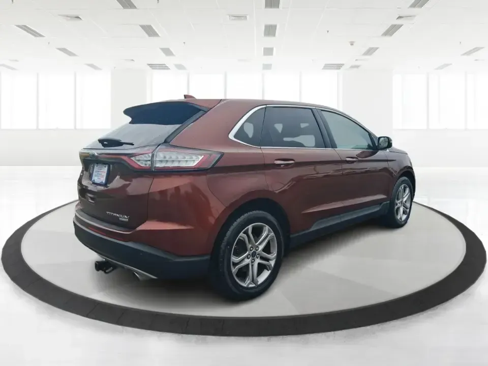 2016 Ford Edge Titanium (2FMPK3K91GB) with an 2.0L L4 DOHC 16V engine, 6A transmission, located at 4508 South Dixie Dr, Moraine, OH, 45439, (937) 908-9800, 39.689976, -84.218452 - Picture your next Ohio weekend: loading up groceries for the week in Moraine, grabbing coffee off South Dixie Drive, then cruising I-75 toward Dayton's Riverscape MetroPark or a quick family road trip to Carillon Historical Park-without feeling cramped, stressed, or under-equipped. This **2016 Ford - Photo#2