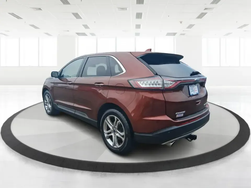 2016 Ford Edge Titanium (2FMPK3K91GB) with an 2.0L L4 DOHC 16V engine, 6A transmission, located at 4508 South Dixie Dr, Moraine, OH, 45439, (937) 908-9800, 39.689976, -84.218452 - Picture your next Ohio weekend: loading up groceries for the week in Moraine, grabbing coffee off South Dixie Drive, then cruising I-75 toward Dayton's Riverscape MetroPark or a quick family road trip to Carillon Historical Park-without feeling cramped, stressed, or under-equipped. This **2016 Ford - Photo#4