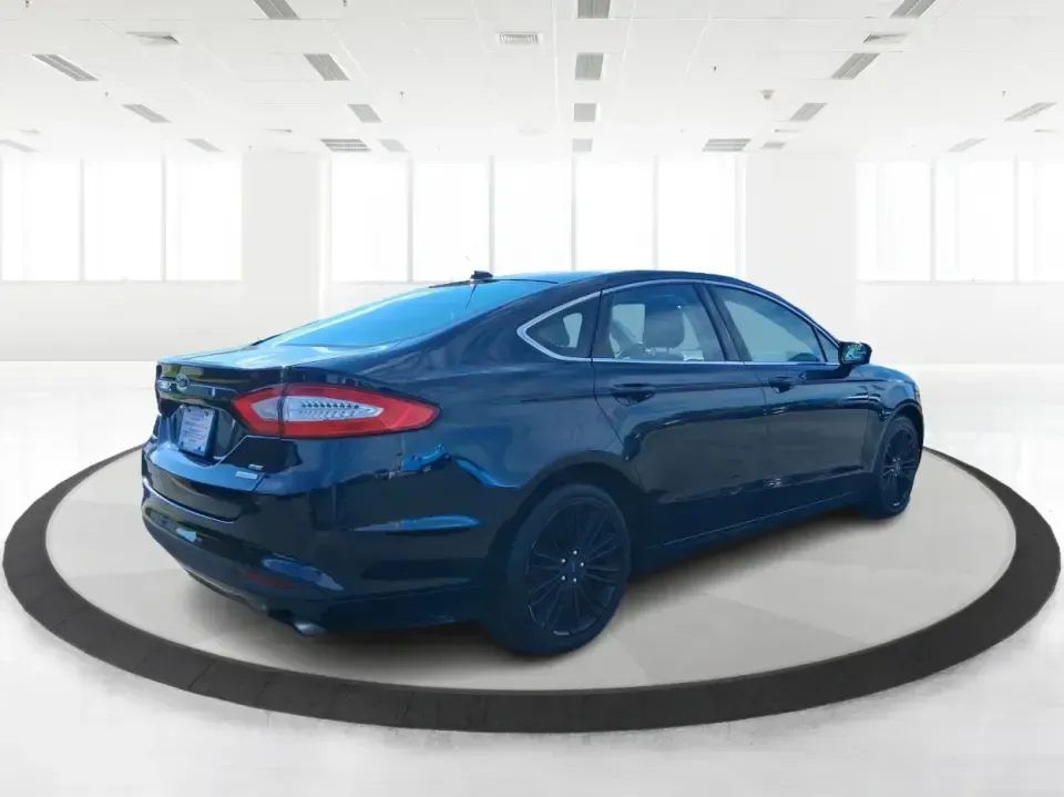 2014 Ford Fusion SE (3FA6P0HD8ER) with an 1.5L L4 DOHC 16V engine, located at 1099 N County Rd 25A , Troy, OH, 45373, (937) 908-9800, 40.057079, -84.212883 - Need a dependable commuter that still feels comfortable for date night in Beavercreek, errands around Xenia Station, and weekend drives out toward Caesars Creek? This 2014 Ford Fusion SE is the kind of smart, budget-friendly sedan that fits real life-easy to park downtown, smooth on longer stretches - Photo#2