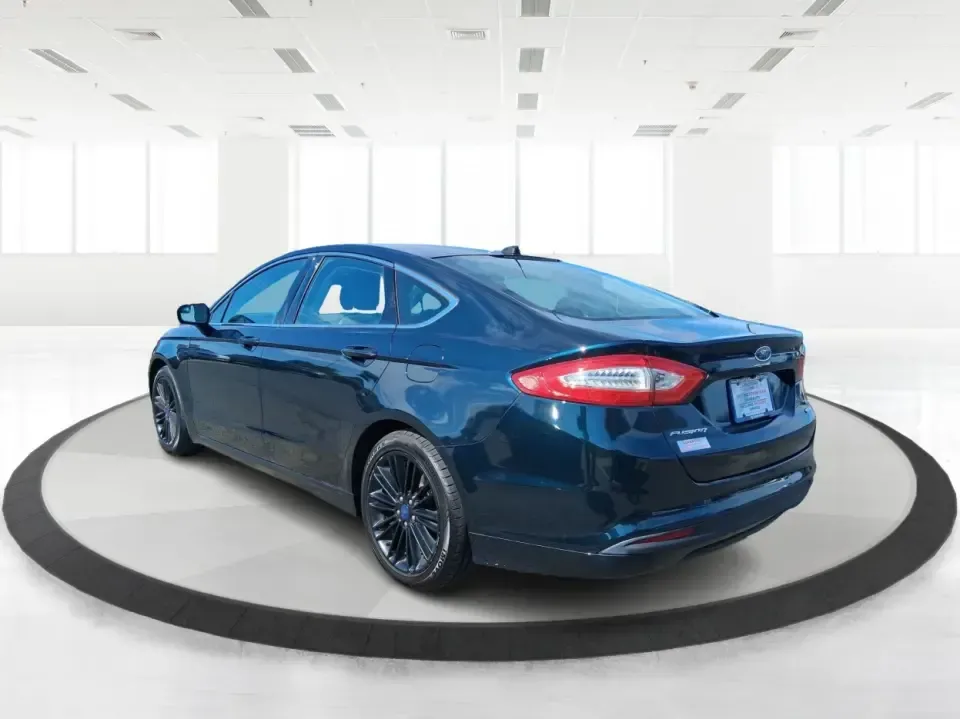 2014 Ford Fusion SE (3FA6P0HD8ER) with an 1.5L L4 DOHC 16V engine, located at 1099 N County Rd 25A , Troy, OH, 45373, (937) 908-9800, 40.057079, -84.212883 - Need a dependable commuter that still feels comfortable for date night in Beavercreek, errands around Xenia Station, and weekend drives out toward Caesars Creek? This 2014 Ford Fusion SE is the kind of smart, budget-friendly sedan that fits real life-easy to park downtown, smooth on longer stretches - Photo#4
