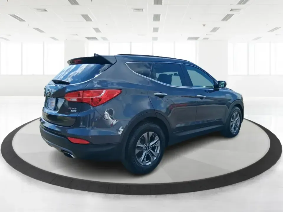 2015 Hyundai Santa Fe 2.4L (5XYZUDLB3FG) with an Theta II 2.4L I-4 gasoline direct injection engine, 6-Speed Automatic transmission, located at 401 Woodman Dr, Riverside, OH, 45431, (937) 908-9800, 39.760899, -84.123421 - Pack up the kids, load the cooler, and point your weekend plans toward the open road-this 2015 Hyundai Santa Fe 2.4L in Platinum Graphite is the kind of SUV that fits real life in Riverside. Whether you're commuting down I-75, running errands along Woodman Dr, or heading out for a day at Eastwood Me - Photo#2