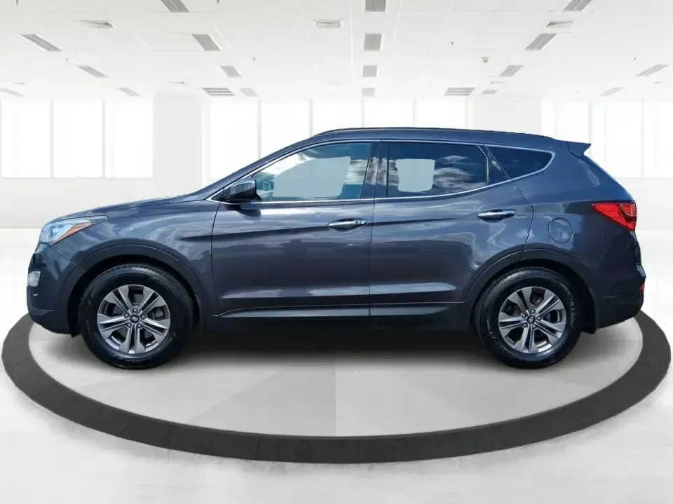 2015 Hyundai Santa Fe 2.4L (5XYZUDLB3FG) with an Theta II 2.4L I-4 gasoline direct injection engine, 6-Speed Automatic transmission, located at 401 Woodman Dr, Riverside, OH, 45431, (937) 908-9800, 39.760899, -84.123421 - Pack up the kids, load the cooler, and point your weekend plans toward the open road-this 2015 Hyundai Santa Fe 2.4L in Platinum Graphite is the kind of SUV that fits real life in Riverside. Whether you're commuting down I-75, running errands along Woodman Dr, or heading out for a day at Eastwood Me - Photo#5