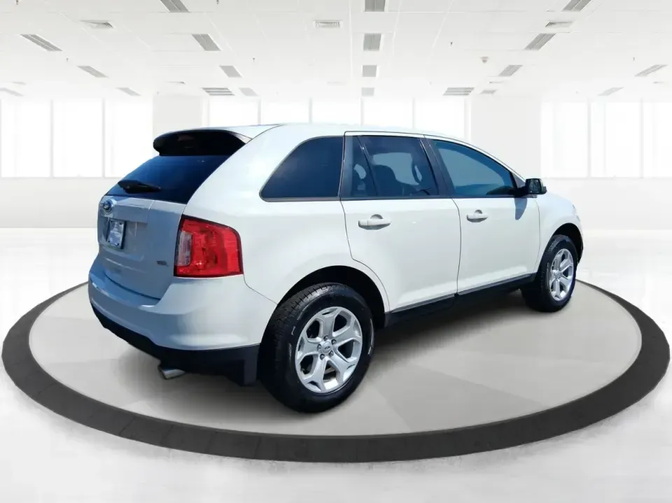 2013 Ford Edge SEL (2FMDK3JC2DB) with an 3.5L V6 DOHC 24V engine, 6-Speed Automatic transmission, located at 8750 N County Rd 25A, Piqua, OH, 45356, (937) 908-9800, 40.164391, -84.232513 - Picture your next road trip up I75 or a busy week of school dropoffs and commuting done in a roomy SUV that feels comfortable, confident, and ready for everyday Ohio life. This 2013 Ford Edge SEL is a smart fit for drivers who want midsize versatility without the bulky footprint-great for growing fa - Photo#2