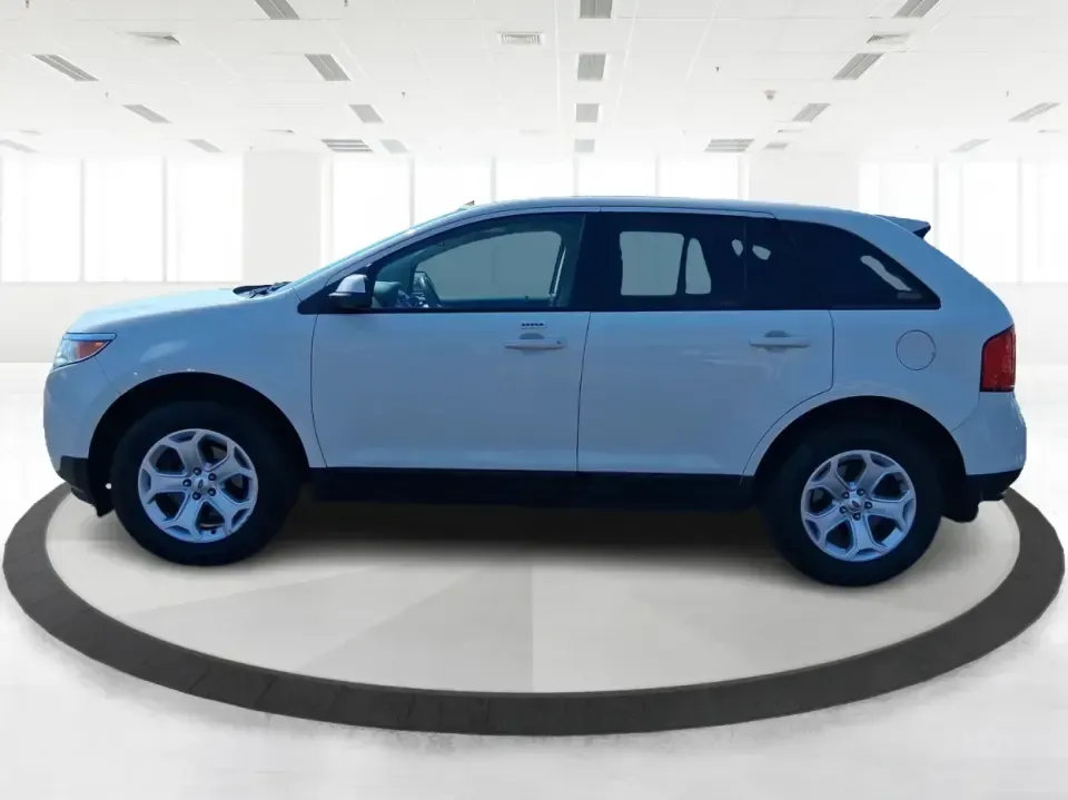2013 Ford Edge SEL (2FMDK3JC2DB) with an 3.5L V6 DOHC 24V engine, 6-Speed Automatic transmission, located at 8750 N County Rd 25A, Piqua, OH, 45356, (937) 908-9800, 40.164391, -84.232513 - Picture your next road trip up I75 or a busy week of school dropoffs and commuting done in a roomy SUV that feels comfortable, confident, and ready for everyday Ohio life. This 2013 Ford Edge SEL is a smart fit for drivers who want midsize versatility without the bulky footprint-great for growing fa - Photo#5
