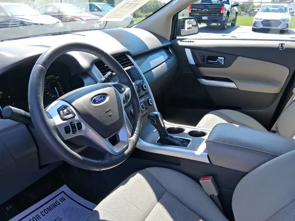 2013 Ford Edge SEL (2FMDK3JC2DB) with an 3.5L V6 DOHC 24V engine, 6-Speed Automatic transmission, located at 8750 N County Rd 25A, Piqua, OH, 45356, (937) 908-9800, 40.164391, -84.232513 - Picture your next road trip up I75 or a busy week of school dropoffs and commuting done in a roomy SUV that feels comfortable, confident, and ready for everyday Ohio life. This 2013 Ford Edge SEL is a smart fit for drivers who want midsize versatility without the bulky footprint-great for growing fa - Photo#9