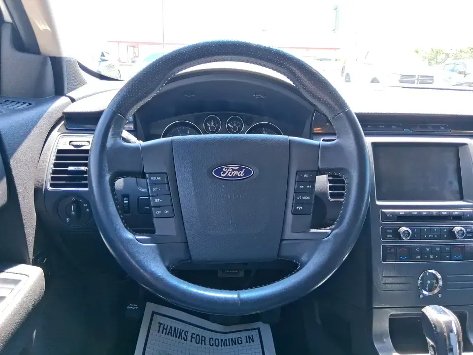 2011 Ford Flex Titanium (2FMGK5DC2BB) with an Duratec 3.5L V-6 DOHC engine, 6-Speed Automatic Overdrive transmission, located at 1951 S Dayton Lakeview Rd., New Carlisle, OH, 45344, (937) 908-9800, 39.890999, -84.050255 - Road-trip ready and family-friendly without feeling like a bus, this 2011 Ford Flex Limited | Titanium is the kind of crossover that fits real life-school drop-offs, long commutes, weekend tournaments, and those last-minute runs for groceries when the cargo space actually matters. Finished in White - Photo#16