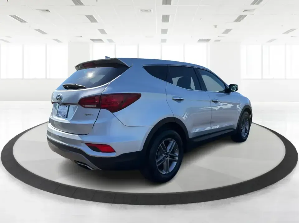 2017 Hyundai Santa Fe 2.4L (5XYZT3LB8HG) with an Theta II 2.4L I-4 gasoline direct injection engine, 6A transmission, located at 8750 N County Rd 25A, Piqua, OH, 45356, (937) 908-9800, 40.164391, -84.232513 - Load up the family, point the GPS toward a weekend getaway, and enjoy the confidence of an SUV that's built for everyday life in Ohio-this **2017 Hyundai Santa Fe 2.4L** is a smart pick for commuting, school runs, and road trips alike. Finished in **Sparkling Silver**, it brings the practical space - Photo#2