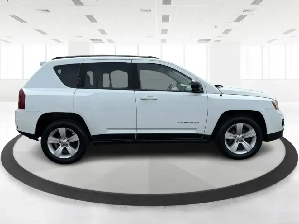 2016 Jeep Compass Sport (1C4NJCBA1GD) with an 2.0L L4 DOHC 16V engine, Automatic transmission, located at 4508 South Dixie Dr, Moraine, OH, 45439, (937) 908-9800, 39.689976, -84.218452 - **Adventure Awaits with the 2016 Jeep Compass Sport in Fairborn, OH!**<br /> <br /> Are you and your family ready to embark on thrilling weekend adventures or find the ideal companion for your daily commute? Look no further! The 2016 Jeep Compass Sport is the perfect SUV for those who need a dependa - Photo#1
