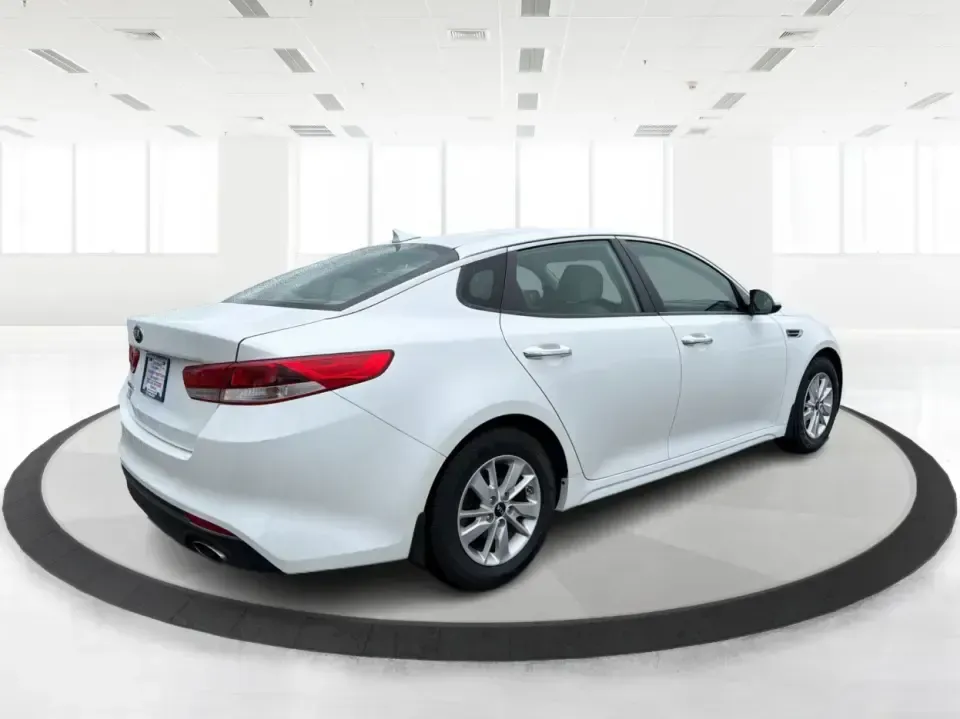 2016 Kia Optima LX (KNAGT4L36G5) with an Theta II 2.4L I-4 gasoline direct injection engine, 6A transmission, located at 401 Woodman Dr, Riverside, OH, 45431, (937) 908-9800, 39.760899, -84.123421 - Need a dependable sedan that can handle the weekday commute down I-675, quick school drop-offs near Mad River, and an easy weekend drive to Carillon Historical Park or a Dayton Dragons game? This 2016 Kia Optima LX in Snow White Pearl delivers the kind of practical comfort and modern tech that fits - Photo#2