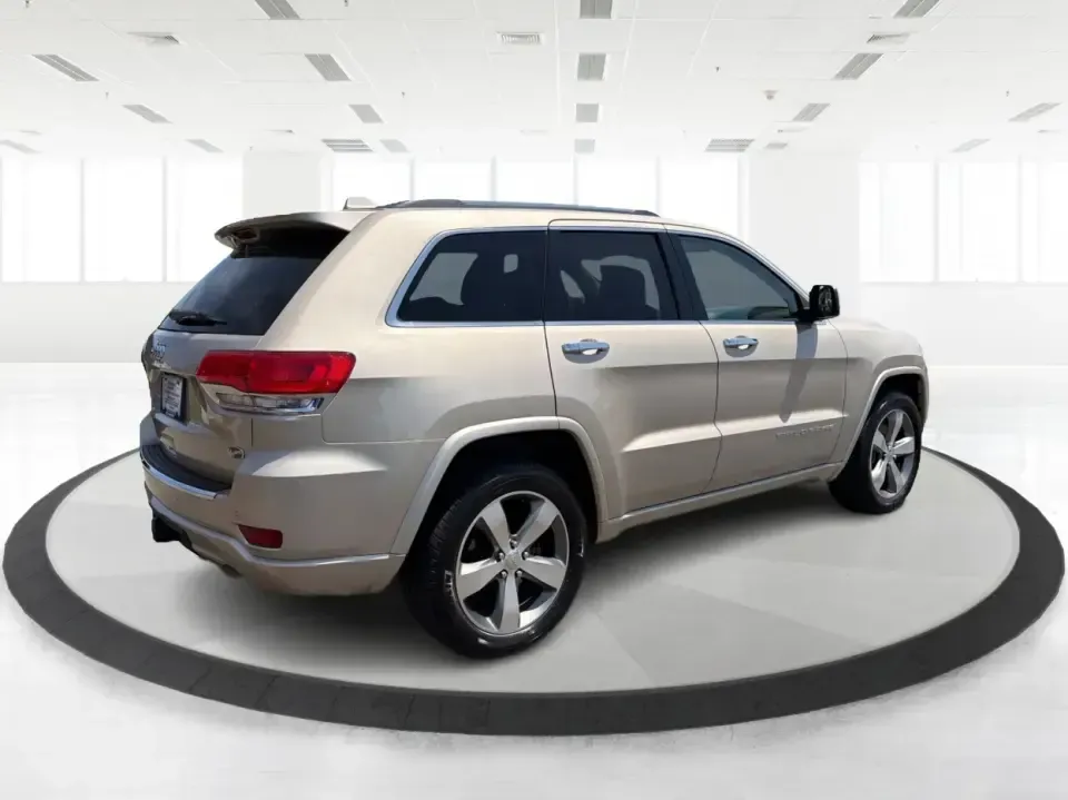 2014 Jeep Grand Cherokee Overland (1C4RJFCTXEC) with an 5.7L V8 OHV 16V engine, 5-Speed Automatic transmission, located at 1184 Kauffman Ave, Fairborn, OH, 45324, (937) 908-9800, 39.807072, -84.030914 - Picture your next weekend: loading up for a road trip to Yellow Springs, cruising I675 with the family in comfort, or heading out to the trails and backroads around Wright-Patterson Air Force Base with the confidence of 4WD. This 2014 Jeep Grand Cherokee Overland is built for drivers who want a refi - Photo#2