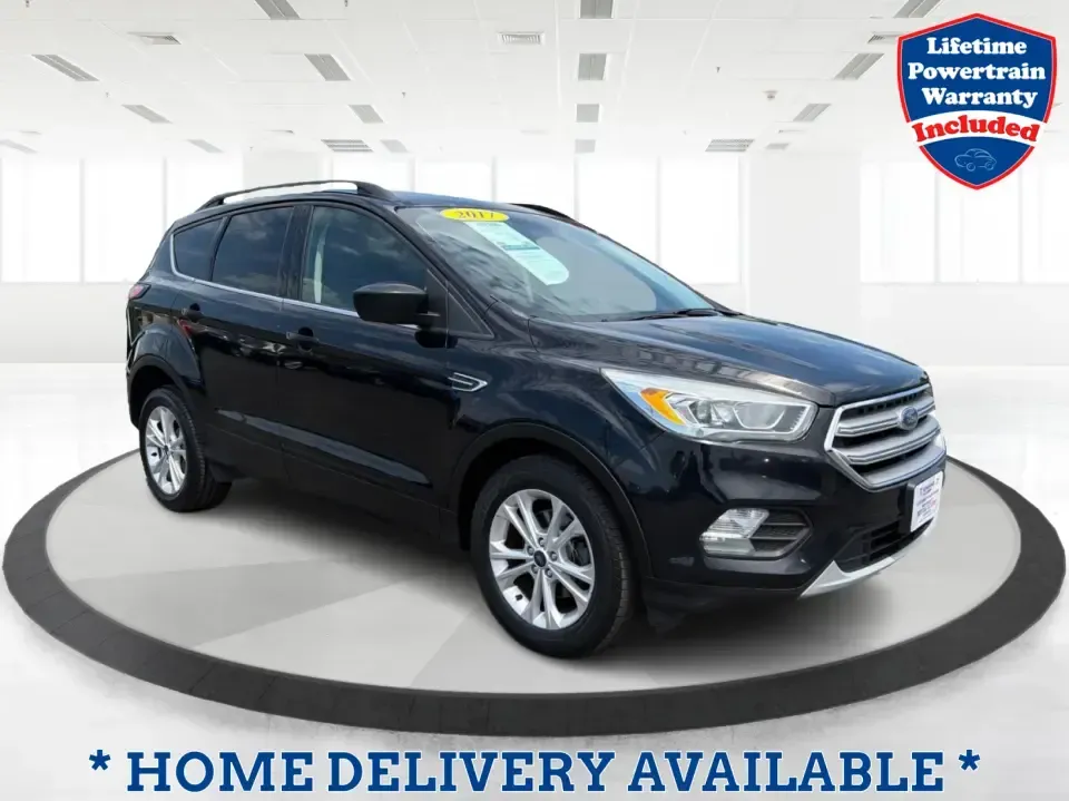 2017 Ford Escape SE (1FMCU0GD1HU) with an 1.5L L4 DOHC 16V engine, 6A transmission, located at 880 E. National Road, Vandalia, OH, 45377, (937) 908-9800, 39.891918, -84.183594 - Need a compact SUV that can handle the weekday commute on I75, school drop-offs around Troy, and spontaneous weekend getaways to Charleston Falls Preserve or a quick stroll through the Troy Strawberry Festival? This 2017 Ford Escape SE in Shadow Black is a practical, easy-to-live-with choice for bus- Photo#0