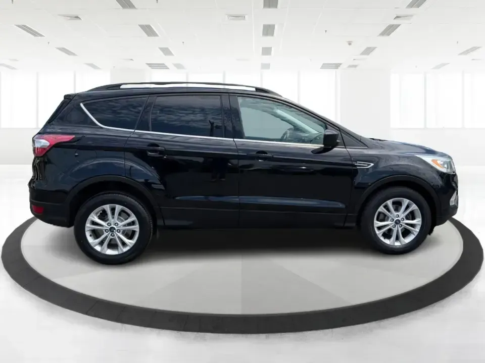 2017 Ford Escape SE (1FMCU0GD1HU) with an 1.5L L4 DOHC 16V engine, 6A transmission, located at 880 E. National Road, Vandalia, OH, 45377, (937) 908-9800, 39.891918, -84.183594 - Need a compact SUV that can handle the weekday commute on I75, school drop-offs around Troy, and spontaneous weekend getaways to Charleston Falls Preserve or a quick stroll through the Troy Strawberry Festival? This 2017 Ford Escape SE in Shadow Black is a practical, easy-to-live-with choice for bus- Photo#1