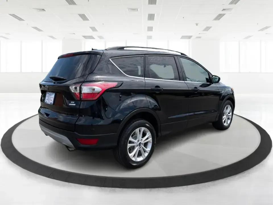 2017 Ford Escape SE (1FMCU0GD1HU) with an 1.5L L4 DOHC 16V engine, 6A transmission, located at 880 E. National Road, Vandalia, OH, 45377, (937) 908-9800, 39.891918, -84.183594 - Need a compact SUV that can handle the weekday commute on I75, school drop-offs around Troy, and spontaneous weekend getaways to Charleston Falls Preserve or a quick stroll through the Troy Strawberry Festival? This 2017 Ford Escape SE in Shadow Black is a practical, easy-to-live-with choice for bus- Photo#2