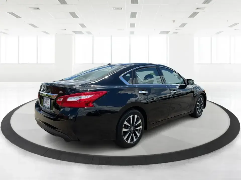2017 Nissan Altima 2.5 SV (1N4AL3AP8HC) with an 2.5L I-4 DOHC engine, CVT transmission, located at 4508 South Dixie Dr, Moraine, OH, 45439, (937) 908-9800, 39.689976, -84.218452 - Need a reliable daily driver for I-75 commutes, Wright-Patterson AFB runs, or quick family errands around Dayton? This 2017 Nissan Altima 2.5 SV in Super Black is a smart, comfortable sedan that fits real life in Moraine-easy to park, efficient to live with, and roomy enough for carpools, groceries,- Photo#2