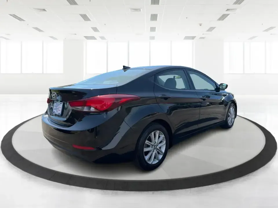 2016 Hyundai Elantra Limited (5NPDH4AE8GH) with an 1.8L L4 DOHC 16V engine, 6-Speed Automatic transmission, located at 4508 South Dixie Dr, Moraine, OH, 45439, (937) 908-9800, 39.689976, -84.218452 - Picture an easy weekday routine: a comfortable, fuel-sipping sedan for the commute down South Dixie Drive, quick school drop-offs, and a smooth Friday escape to Carillon Historical Park or a Dayton Dragons game. This **2016 Hyundai Elantra Limited** in **Phantom Black** is the kind of practical, pol- Photo#2