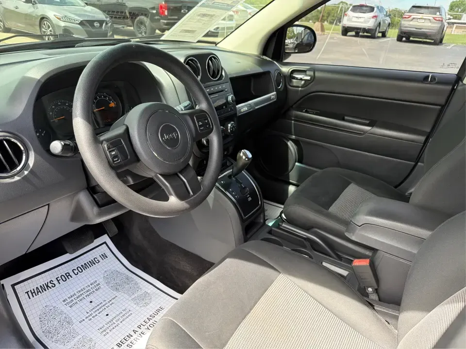 2015 Jeep Compass Sport FWD (1C4NJCBA6FD) with an 2.0L L4 DOHC 16V engine, located at 880 E. National Road, Vandalia, OH, 45377, (937) 908-9800, 39.891918, -84.183594 - Weekday commutes down I75, school drop-offs in Butler Township, and quick weekend getaways to the National Museum of the U.S. Air Force or Taylorsville MetroPark all call for an SUV that's easy to live with, comfortable for five, and efficient enough to keep your budget in check. This **2015 Jeep Co- Photo#9