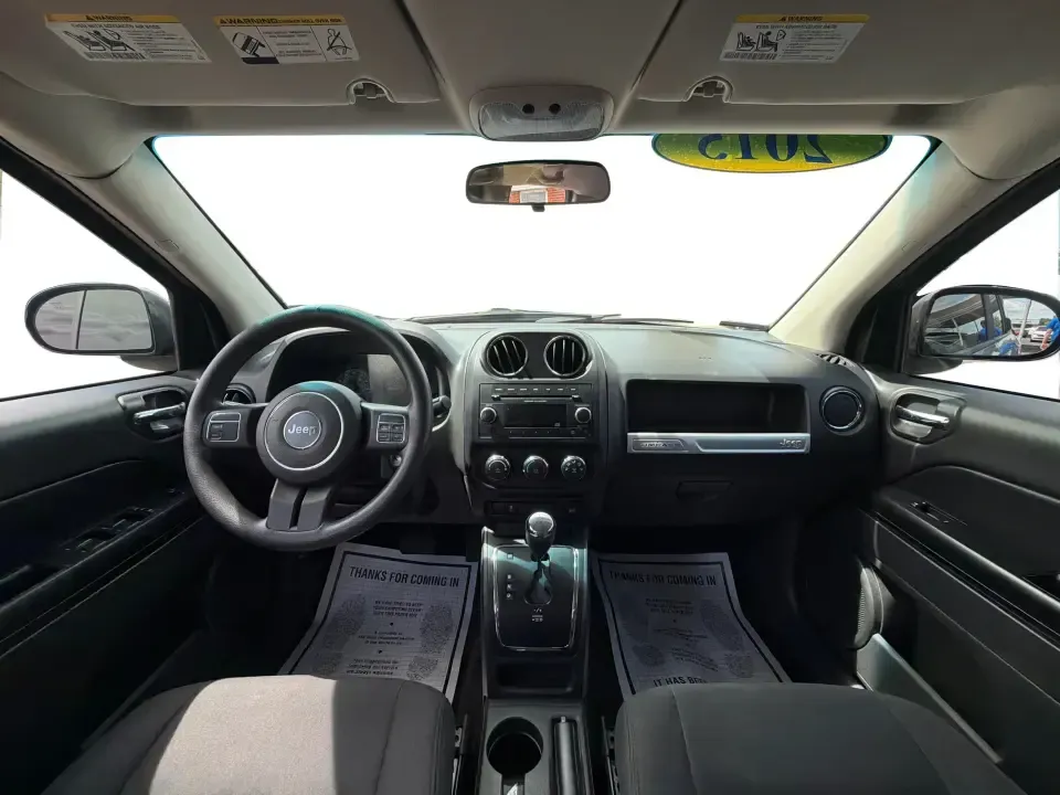 2015 Jeep Compass Sport FWD (1C4NJCBA6FD) with an 2.0L L4 DOHC 16V engine, located at 880 E. National Road, Vandalia, OH, 45377, (937) 908-9800, 39.891918, -84.183594 - Weekday commutes down I75, school drop-offs in Butler Township, and quick weekend getaways to the National Museum of the U.S. Air Force or Taylorsville MetroPark all call for an SUV that's easy to live with, comfortable for five, and efficient enough to keep your budget in check. This **2015 Jeep Co- Photo#19