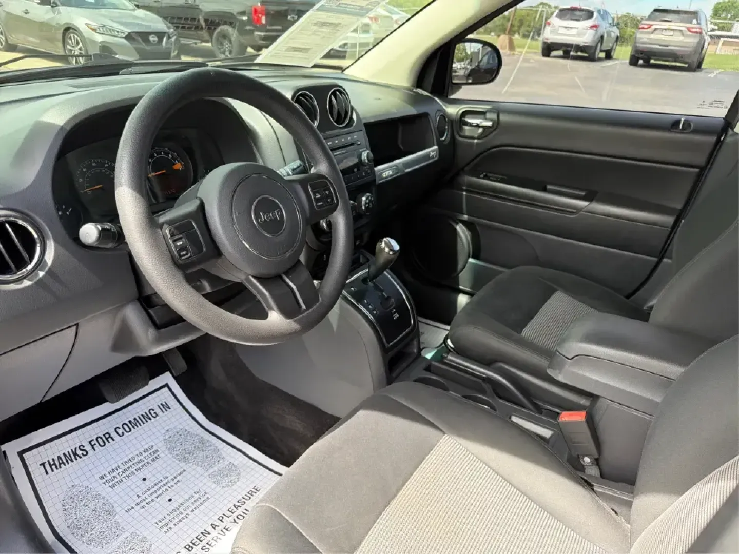 2015 Jeep Compass Sport FWD (1C4NJCBA6FD) with an 2.0L L4 DOHC 16V engine, located at 1951 S Dayton Lakeview Rd., New Carlisle, OH, 45344, (937) 908-9800, 39.890999, -84.050255 - Whether your week looks like a daily commute down I70, school drop-offs around Clark County, or a quick weekend escape to Buck Creek State Park, this **2015 Jeep Compass Sport FWD** is the kind of compact SUV that fits real life. With seating for **five**, easy-to-park sizing, and the versatile carg- Photo#9