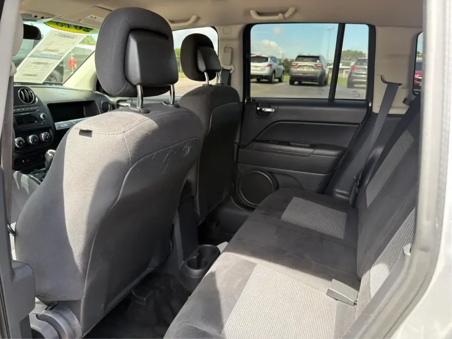 2015 Jeep Compass Sport FWD (1C4NJCBA6FD) with an 2.0L L4 DOHC 16V engine, located at 1951 S Dayton Lakeview Rd., New Carlisle, OH, 45344, (937) 908-9800, 39.890999, -84.050255 - Whether your week looks like a daily commute down I70, school drop-offs around Clark County, or a quick weekend escape to Buck Creek State Park, this **2015 Jeep Compass Sport FWD** is the kind of compact SUV that fits real life. With seating for **five**, easy-to-park sizing, and the versatile carg- Photo#10