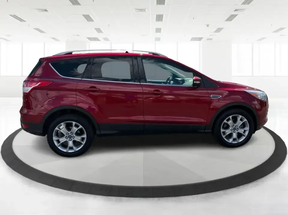 2014 Ford Escape Titanium 4WD (1FMCU9J91EU) with an 2.0L L4 DOHC 16V engine, 6-Speed Automatic transmission, located at 1099 N County Rd 25A , Troy, OH, 45373, (937) 908-9800, 40.057079, -84.212883 - Weekend getaways to Hocking Hills, snowy commutes up I75, or the everyday school-and-grocery loop around Troy-this 2014 Ford Escape Titanium 4WD is built for the kind of life that doesn't slow down when the weather changes. With seating for five, flexible cargo space, and confident four-wheel drive,- Photo#1