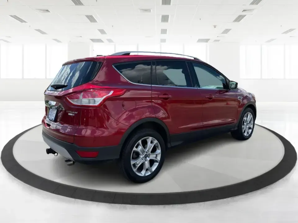 2014 Ford Escape Titanium 4WD (1FMCU9J91EU) with an 2.0L L4 DOHC 16V engine, 6-Speed Automatic transmission, located at 1099 N County Rd 25A , Troy, OH, 45373, (937) 908-9800, 40.057079, -84.212883 - Weekend getaways to Hocking Hills, snowy commutes up I75, or the everyday school-and-grocery loop around Troy-this 2014 Ford Escape Titanium 4WD is built for the kind of life that doesn't slow down when the weather changes. With seating for five, flexible cargo space, and confident four-wheel drive,- Photo#2