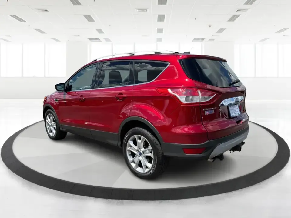 2014 Ford Escape Titanium 4WD (1FMCU9J91EU) with an 2.0L L4 DOHC 16V engine, 6-Speed Automatic transmission, located at 1099 N County Rd 25A , Troy, OH, 45373, (937) 908-9800, 40.057079, -84.212883 - Weekend getaways to Hocking Hills, snowy commutes up I75, or the everyday school-and-grocery loop around Troy-this 2014 Ford Escape Titanium 4WD is built for the kind of life that doesn't slow down when the weather changes. With seating for five, flexible cargo space, and confident four-wheel drive,- Photo#4
