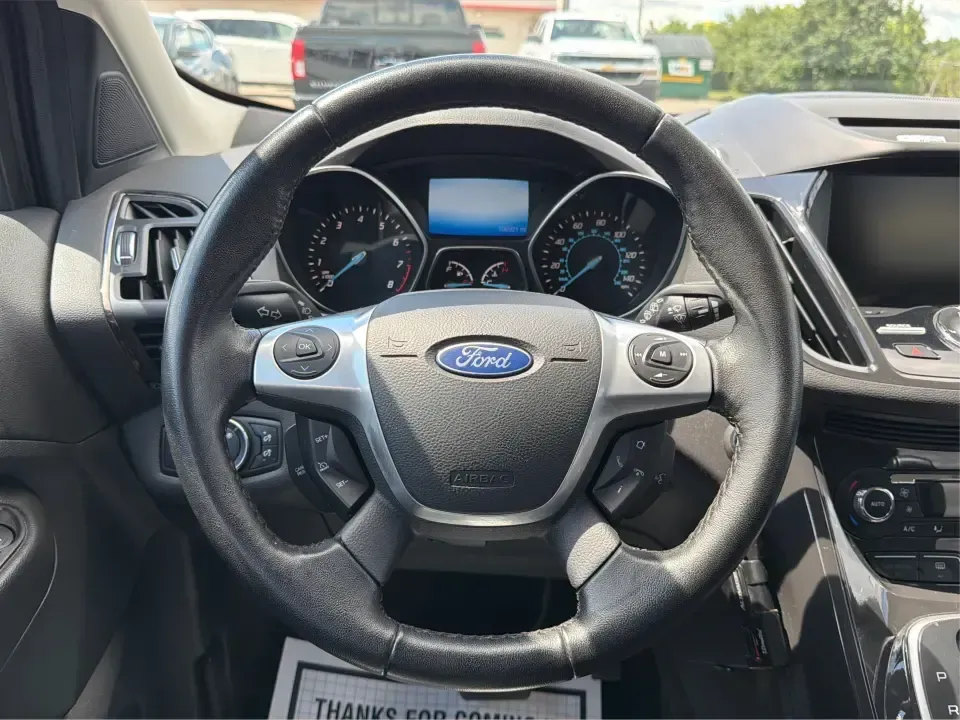 2014 Ford Escape Titanium 4WD (1FMCU9J91EU) with an 2.0L L4 DOHC 16V engine, 6-Speed Automatic transmission, located at 1099 N County Rd 25A , Troy, OH, 45373, (937) 908-9800, 40.057079, -84.212883 - Weekend getaways to Hocking Hills, snowy commutes up I75, or the everyday school-and-grocery loop around Troy-this 2014 Ford Escape Titanium 4WD is built for the kind of life that doesn't slow down when the weather changes. With seating for five, flexible cargo space, and confident four-wheel drive,- Photo#16