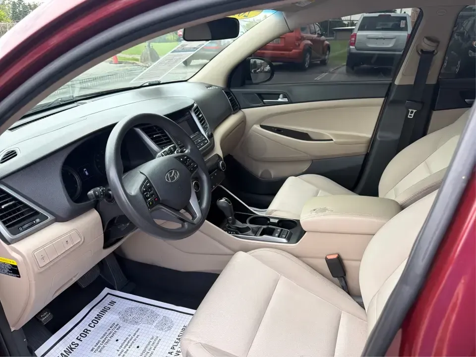 2017 Hyundai Tucson SE w/Preferred Package AWD (KM8J3CA42HU) with an 2.0L L4 DOHC 16V engine, 6A transmission, located at 1230 East Main St, Xenia, OH, 45385, (937) 908-9800, 39.688026, -83.910172 - Weekend getaways to John Bryan State Park, snowy school runs, and daily commutes down US-35 all ask for the same thing: a compact SUV that feels confident, comfortable, and ready for real life. This 2017 Hyundai Tucson SE w/Preferred Package AWD in Ruby Wine is a practical choice for drivers who wan- Photo#9
