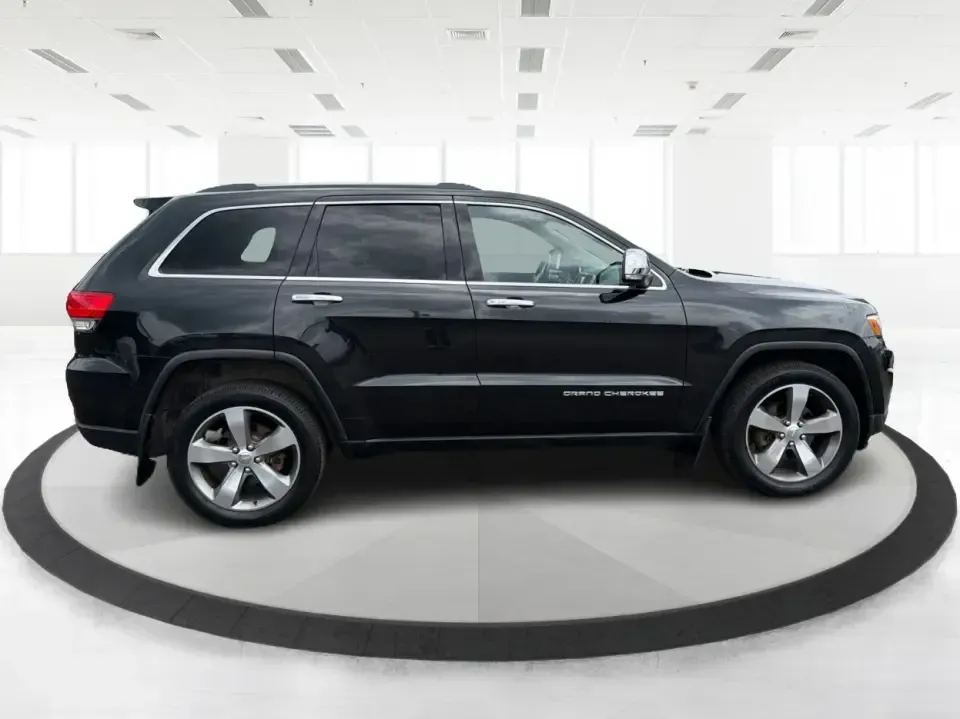 2014 Jeep Grand Cherokee Limited 4WD (1C4RJFBG8EC) with an 3.6L V6 DOHC 24V engine, 5-Speed Automatic transmission, located at 8750 N County Rd 25A, Piqua, OH, 45356, (937) 908-9800, 40.164391, -84.232513 - Need one SUV that can handle weekday commuting up I75, school drop-offs around Piqua, and spontaneous weekend getaways to the Great Miami River trails? This 2014 Jeep Grand Cherokee Limited 4WD brings the confident, all-season versatility Jeep is known for-wrapped in a sharp Brilliant Black Crystal- Photo#1
