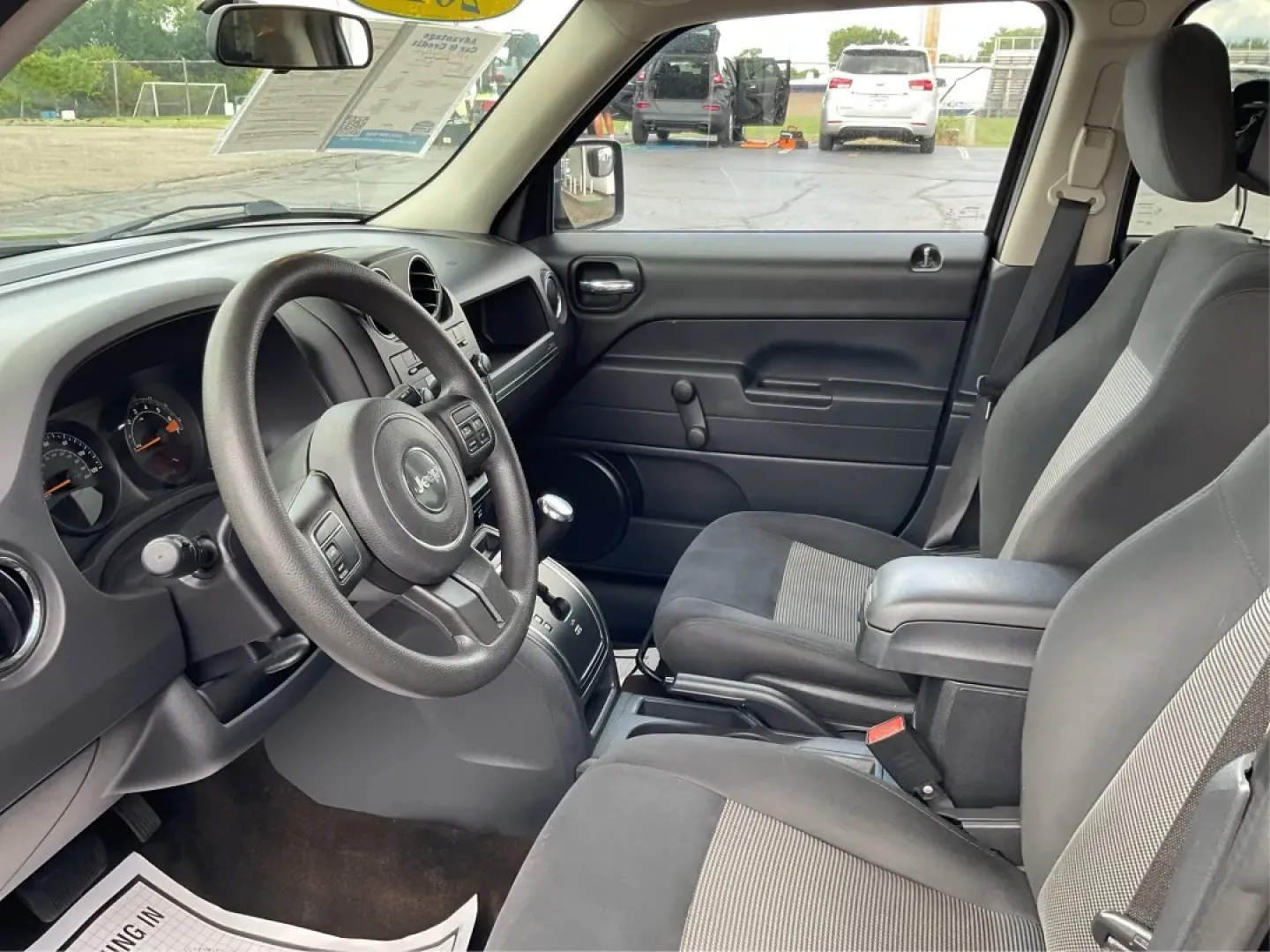 2015 Jeep Patriot Sport 2WD (1C4NJPBA6FD) with an 2.0L L4 DOHC 16V engine, located at 1099 N County Rd 25A , Troy, OH, 45373, (937) 908-9800, 40.057079, -84.212883 - **Adventure Awaits in the 2015 Jeep Patriot Your Perfect Companion for Weekend Getaways!**<br /> <br /> Imagine hitting the open road with the wind in your hair, the sound of your favorite playlist filling the cabin, and the freedom to explore every hidden gem along the way. The 2015 Jeep Patriot i - Photo#9