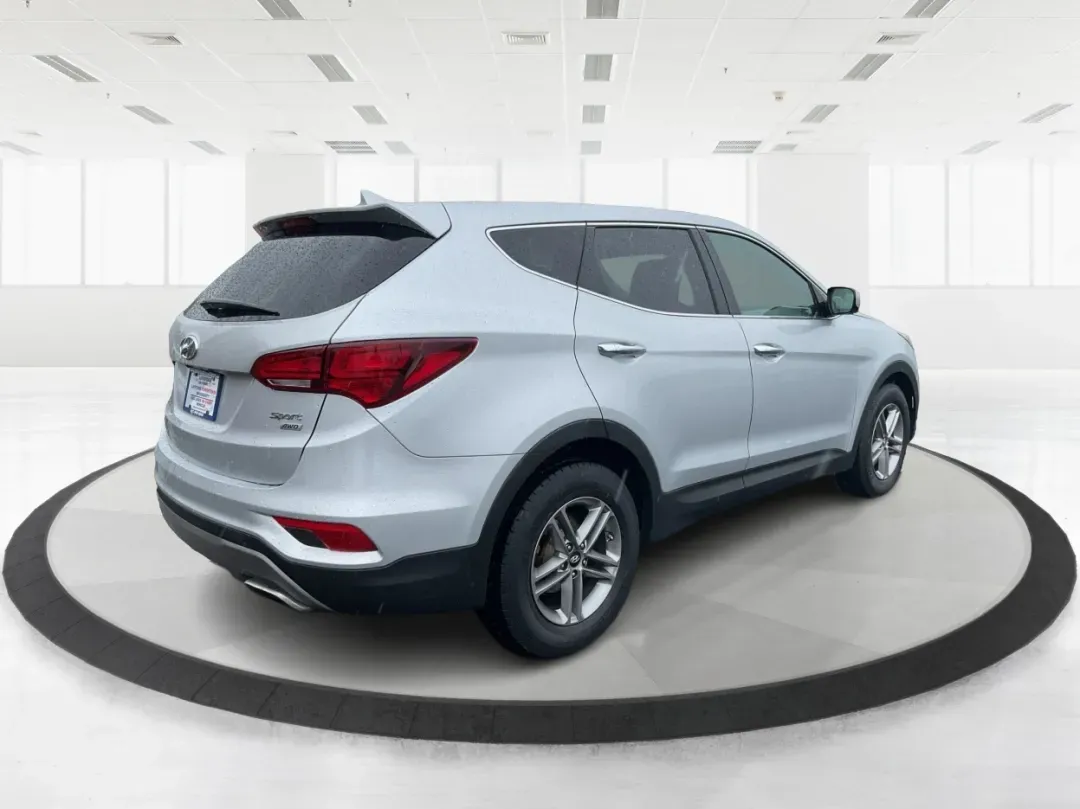 2017 Hyundai Santa Fe 2.4L (5XYZTDLB2HG) with an Theta II 2.4L I-4 gasoline direct injection engine, located at 4508 South Dixie Dr, Moraine, OH, 45439, (937) 908-9800, 39.689976, -84.218452 - Discover the perfect blend of comfort, capability, and style with the 2017 Hyundai Santa Fe, now available at Advantage Car and Credit, located at 1184 Kauffman Ave, Fairborn, OH 45324. This versatile SUV is an excellent choice for growing families, weekend adventurers, or budget-conscious buyers lo - Photo#2