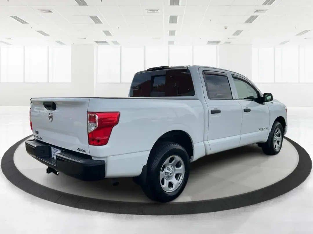 2021 Nissan TITAN Crew Cab S 4x4 (1N6AA1EC4MN) with an Endurance 5.6L V-8 gasoline direct injection engine, located at 1099 N County Rd 25A , Troy, OH, 45373, (937) 908-9800, 40.057079, -84.212883 - Discover ultimate versatility and rugged capability with this 2021 Nissan TITAN Crew Cab S 4x4, now available at Advantage Car and Credit in Piqua, OH. Whether you're navigating the bustling streets of Piqua or heading out for weekend adventures, this truck is designed to adapt to your lifestyle. Pe - Photo#2