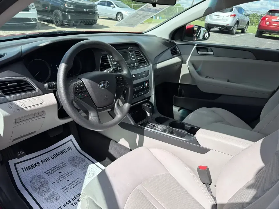 2017 Hyundai Sonata Base (5NPE24AF8HH) with an 2.4L L4 DOHC 16V engine, 7A transmission, located at 1099 N County Rd 25A , Troy, OH, 45373, (937) 908-9800, 40.057079, -84.212883 - Need a reliable, comfortable sedan for the daily drive from Troy to Dayton, school drop-offs, or quick weekend getaways to Charleston Falls Preserve? This red 2017 Hyundai Sonata Base is built for real life-easy to park downtown near the Miami County Courthouse, smooth on I75, and efficient enough f- Photo#9