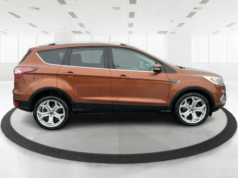 2017 Ford Escape Titanium 4WD (1FMCU9J94HU) with an 2.0L L4 DOHC 16V engine, 6A transmission, located at 8750 N County Rd 25A, Piqua, OH, 45356, (937) 908-9800, 40.164391, -84.232513 - Load up the family, point the hood toward Indian Lake for a weekend escape, or make your daily commute down I75 feel a lot more comfortable-this 2017 Ford Escape Titanium 4WD is the kind of compact SUV that fits real life in Piqua, OH. With confident four-wheel drive for unpredictable Midwest weathe- Photo#1