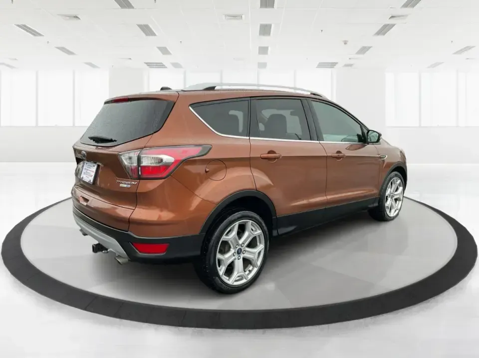 2017 Ford Escape Titanium 4WD (1FMCU9J94HU) with an 2.0L L4 DOHC 16V engine, 6A transmission, located at 8750 N County Rd 25A, Piqua, OH, 45356, (937) 908-9800, 40.164391, -84.232513 - Load up the family, point the hood toward Indian Lake for a weekend escape, or make your daily commute down I75 feel a lot more comfortable-this 2017 Ford Escape Titanium 4WD is the kind of compact SUV that fits real life in Piqua, OH. With confident four-wheel drive for unpredictable Midwest weathe- Photo#2