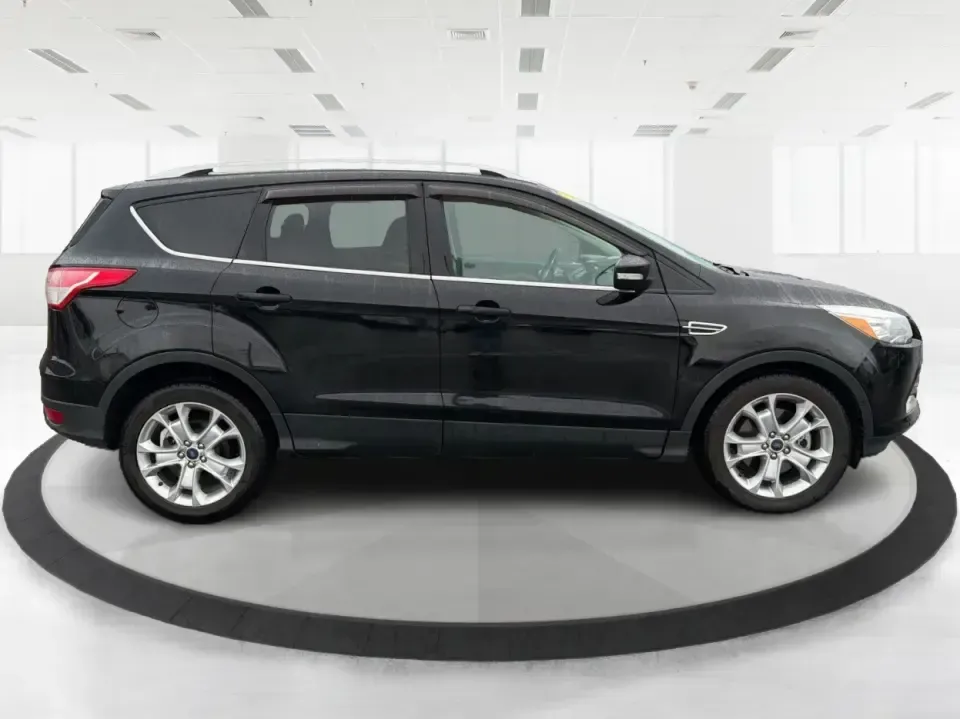 2016 Ford Escape Titanium (1FMCU0J94GU) with an 2.0L L4 DOHC 16V engine, 6-Speed Automatic transmission, located at 8750 N County Rd 25A, Piqua, OH, 45356, (937) 908-9800, 40.164391, -84.232513 - **Explore New Adventures with the 2016 Ford Escape Titanium Perfect for Families and Commuters Alike!**<br /> <br /> Are you ready to elevate your driving experience? The 2016 Ford Escape Titanium is the ideal companion for both bustling family life and daily commutes, bringing together style, comf - Photo#1