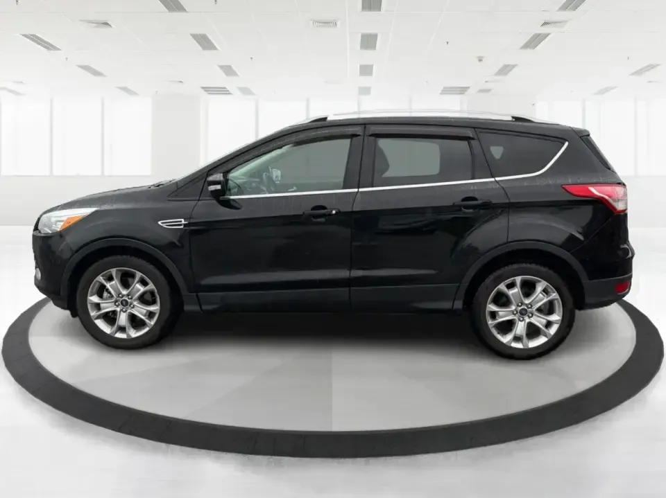 2016 Ford Escape Titanium (1FMCU0J94GU) with an 2.0L L4 DOHC 16V engine, 6-Speed Automatic transmission, located at 8750 N County Rd 25A, Piqua, OH, 45356, (937) 908-9800, 40.164391, -84.232513 - **Explore New Adventures with the 2016 Ford Escape Titanium Perfect for Families and Commuters Alike!**<br /> <br /> Are you ready to elevate your driving experience? The 2016 Ford Escape Titanium is the ideal companion for both bustling family life and daily commutes, bringing together style, comf - Photo#5