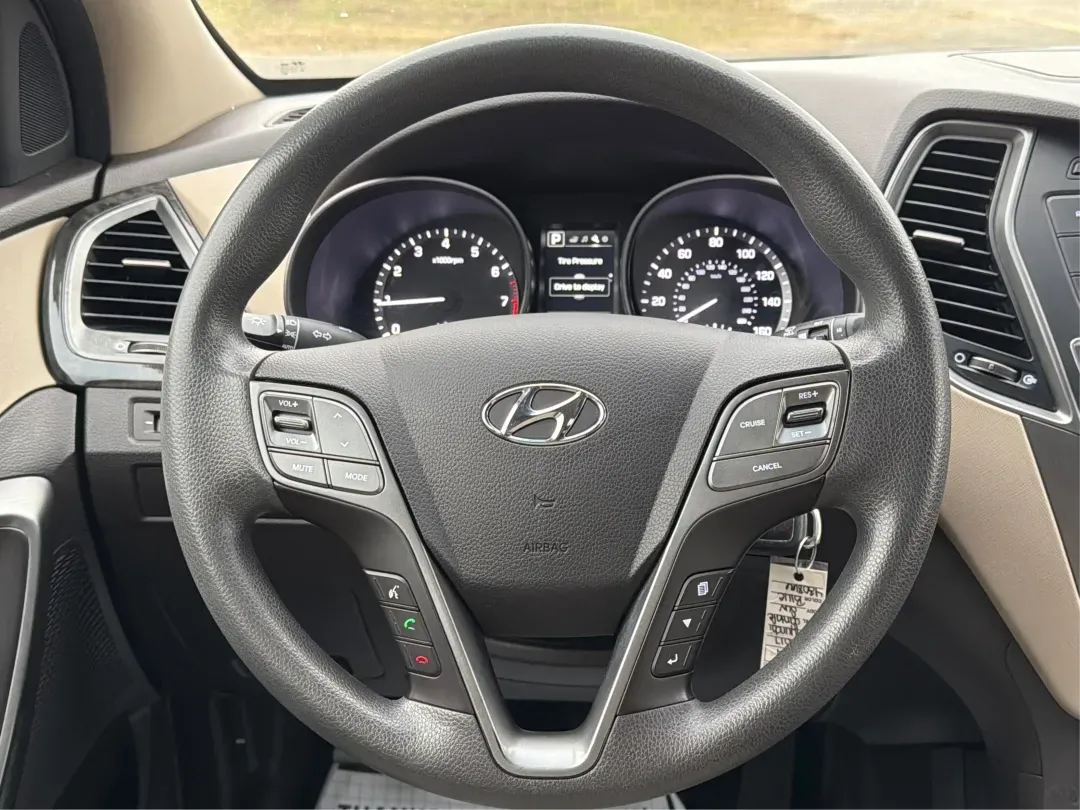 2017 Hyundai Santa Fe 2.4L (5XYZTDLB6HG) with an Theta II 2.4L I-4 gasoline direct injection engine, located at 1099 N County Rd 25A , Troy, OH, 45373, (937) 908-9800, 40.057079, -84.212883 - 2017 Hyundai Santa Fe 2.4L - Photo#16