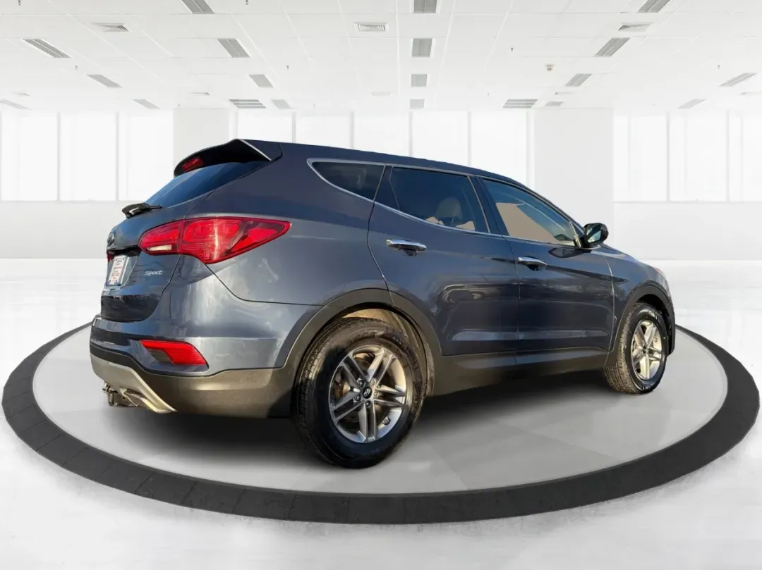 2017 Hyundai Santa Fe 2.4L (5NMZT3LBXHH) with an Theta II 2.4L I-4 gasoline direct injection engine, located at 880 E. National Road, Vandalia, OH, 45377, (937) 908-9800, 39.891918, -84.183594 - 2017 Hyundai Santa Fe 2.4L - Photo#2