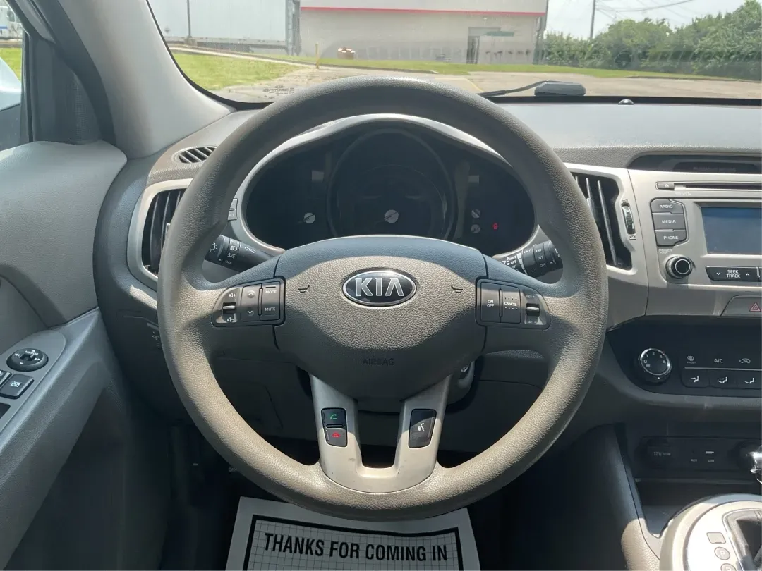 2016 Kia Sportage LX (KNDPBCACXG7) with an Theta II 2.4L I-4 gasoline direct injection engine, located at 1230 East Main St, Xenia, OH, 45385, (937) 908-9800, 39.688026, -83.910172 - Embrace the journey of life with the 2016 Kia Sportage LX, a vehicle designed for those who thrive on adventure and seek comfort in their daily commute. Whether you're navigating the bustling streets of Fairborn, OH, or embarking on a weekend family getaway, this versatile crossover is your perfect - Photo#16