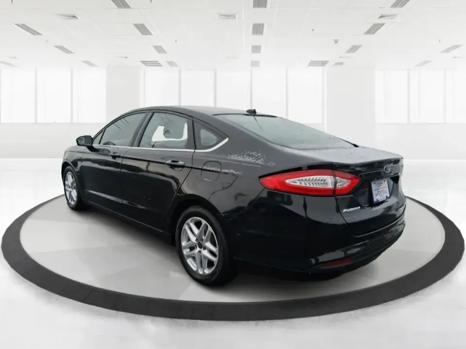 2014 Ford Fusion SE (1FA6P0H77E5) with an 2.5L L4 DOHC 16V engine, Automatic transmission, located at 880 E. National Road, Vandalia, OH, 45377, (937) 908-9800, 39.891918, -84.183594 - Need a dependable sedan for the daily commute up I75, school drop-offs around Vandalia-Butler City Schools, and comfortable weekend drives to the National Museum of the U.S. Air Force? This 2014 Ford Fusion SE is built for real life-smooth on longer stretches of E. National Road, easy to park for er - Photo#4
