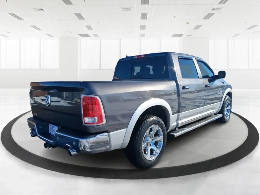 2016 Ram 1500 Laramie (1C6RR7NT1GS) with an 5.7L V8 OHV 16V engine, 6A transmission, located at 1099 N County Rd 25A , Troy, OH, 45373, (937) 908-9800, 40.057079, -84.212883 - Built for Ohio backroads, weekend lake runs, and the kind of workday that doesn't stop when the weather turns, this 2016 Ram 1500 Laramie Crew Cab 4WD is the truck that fits real life in Troy. Whether you're towing a trailer out toward the Miami County Fairgrounds, hauling gear for a Saturday at Tre - Photo#2