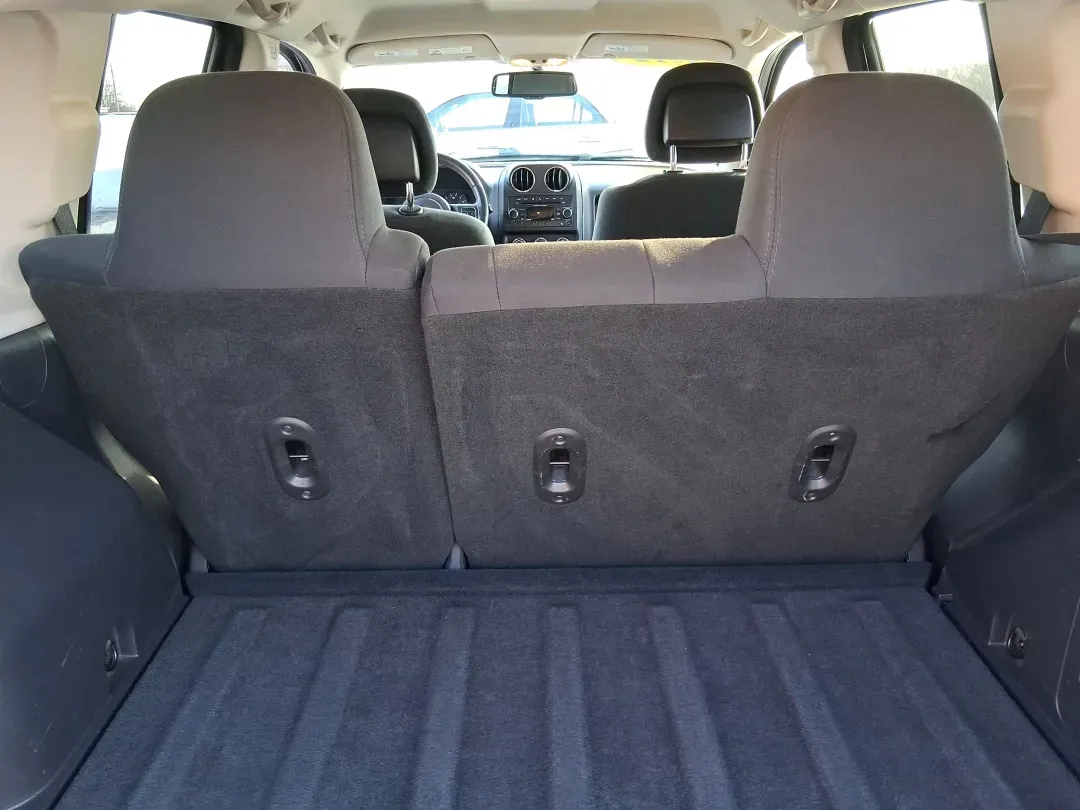 2012 Jeep Compass Latitude (1C4NJDEB4CD) with an 2.4L I-4 DOHC engine, Continuously Variable Transmission transmission, located at 8750 N County Rd 25A, Piqua, OH, 45356, (937) 908-9800, 40.164391, -84.232513 - Need a do-it-all SUV that fits real life in West Central Ohio-school drop-offs, long commutes up I75, and spontaneous weekend escapes to the trails around Johnston Farm and Indian Agency? This 2012 Jeep Compass Latitude 4WD in Bright White Clearcoat is built for that everyday adventure lifestyle, - Photo#11