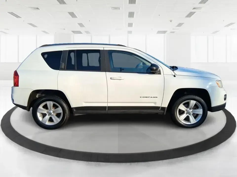 2012 Jeep Compass Latitude (1C4NJDEB4CD) with an 2.4L I-4 DOHC engine, Continuously Variable Transmission transmission, located at 4508 South Dixie Dr, Moraine, OH, 45439, (937) 908-9800, 39.689976, -84.218452 - Need a do-it-all SUV that fits real life in West Central Ohio-school drop-offs, long commutes up I75, and spontaneous weekend escapes to the trails around Johnston Farm and Indian Agency? This 2012 Jeep Compass Latitude 4WD in Bright White Clearcoat is built for that everyday adventure lifestyle, - Photo#1