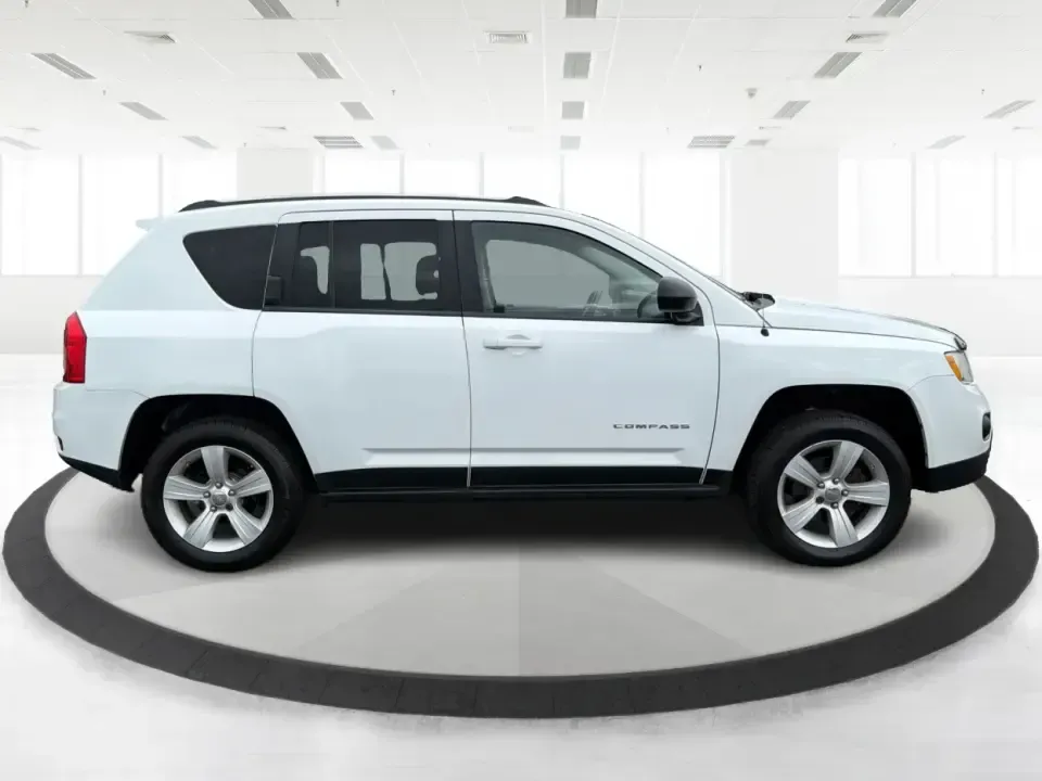 2012 Jeep Compass Latitude (1C4NJDEB4CD) with an 2.4L I-4 DOHC engine, Continuously Variable Transmission transmission, located at 1184 Kauffman Ave, Fairborn, OH, 45324, (937) 908-9800, 39.807072, -84.030914 - Need a do-it-all SUV that fits real life in West Central Ohio-school drop-offs, long commutes up I75, and spontaneous weekend escapes to the trails around Johnston Farm and Indian Agency? This 2012 Jeep Compass Latitude 4WD in Bright White Clearcoat is built for that everyday adventure lifestyle, - Photo#1