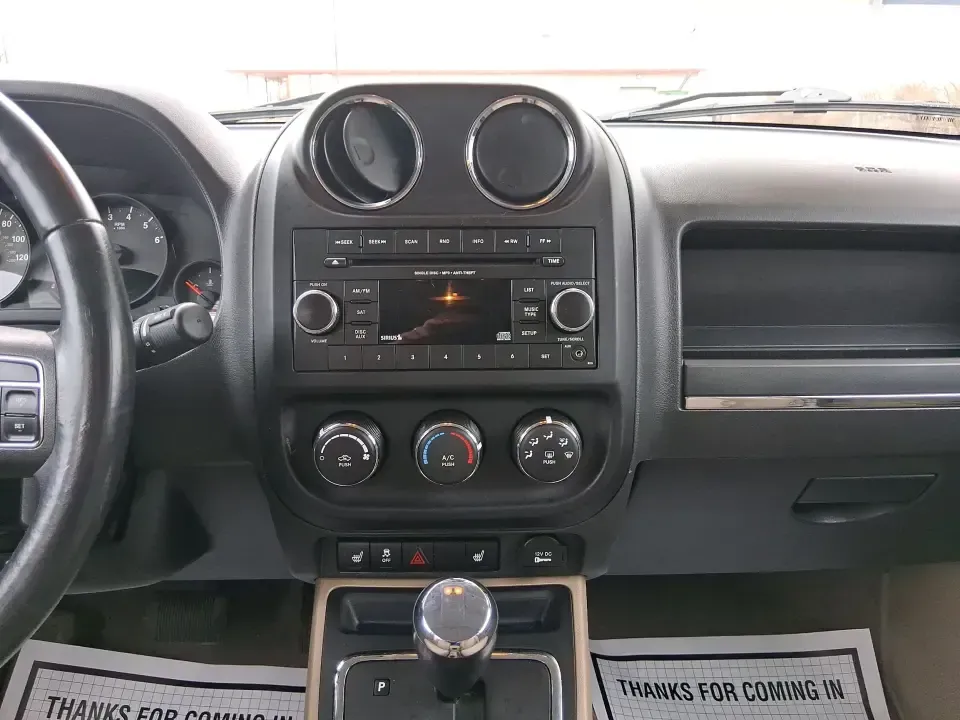 2012 Jeep Patriot Latitude (1C4NJPFB0CD) with an 2.4L L4 DOHC 16V engine, located at 1099 N County Rd 25A , Troy, OH, 45373, (937) 908-9800, 40.057079, -84.212883 - Picture your next weekend: a quick run up I-75 for a family visit, a scenic drive past the Miami River, then an easy loop back through downtown Troy for dinner-without worrying about whether your SUV can keep up with daily life. This 2012 Jeep Patriot Latitude is built for practical adventures and e - Photo#13