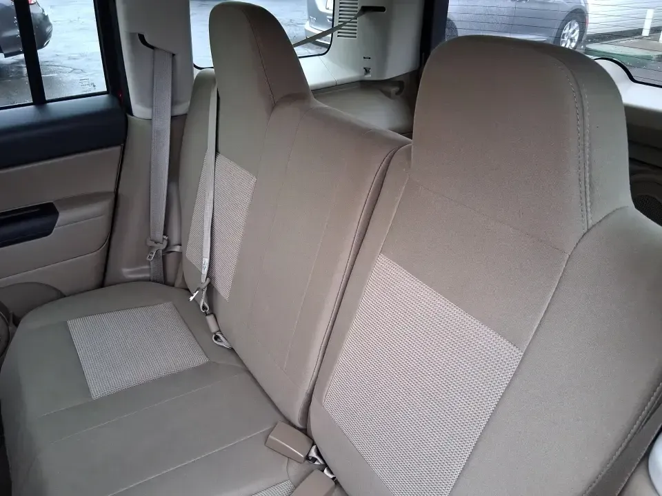 2012 Jeep Patriot Latitude (1C4NJPFB0CD) with an 2.4L L4 DOHC 16V engine, located at 1230 East Main St, Xenia, OH, 45385, (937) 908-9800, 39.688026, -83.910172 - Picture your next weekend: a quick run up I-75 for a family visit, a scenic drive past the Miami River, then an easy loop back through downtown Troy for dinner-without worrying about whether your SUV can keep up with daily life. This 2012 Jeep Patriot Latitude is built for practical adventures and e - Photo#10