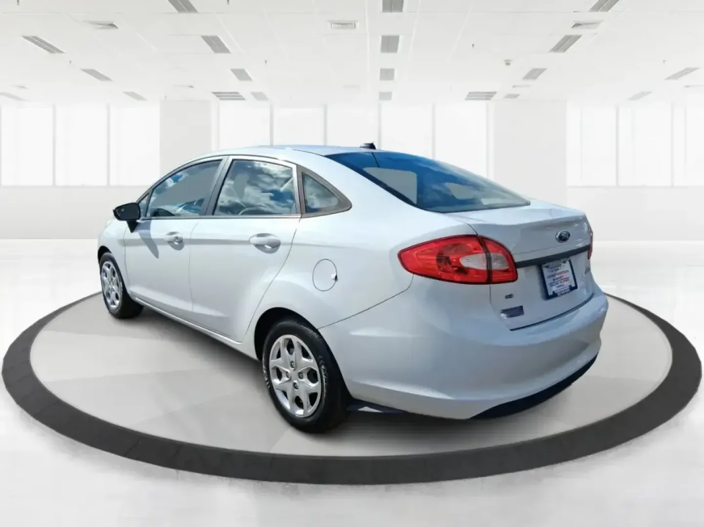 2013 Ford Fiesta SE (3FADP4BJXDM) with an 1.6L I-4 DOHC engine, located at 1951 S Dayton Lakeview Rd., New Carlisle, OH, 45344, (937) 908-9800, 39.890999, -84.050255 - Need a smart, efficient commuter that's easy to park downtown, nimble on I70, and still comfortable for weekend errands or a quick getaway to Springfield or Dayton? This 2013 Ford Fiesta SE Sedan in Oxford White delivers practical daily driving with the kind of budget-friendly ownership that fits re - Photo#4